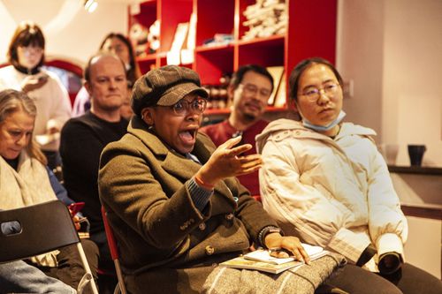 Audience member laughing during the sold-out "China Story" event.