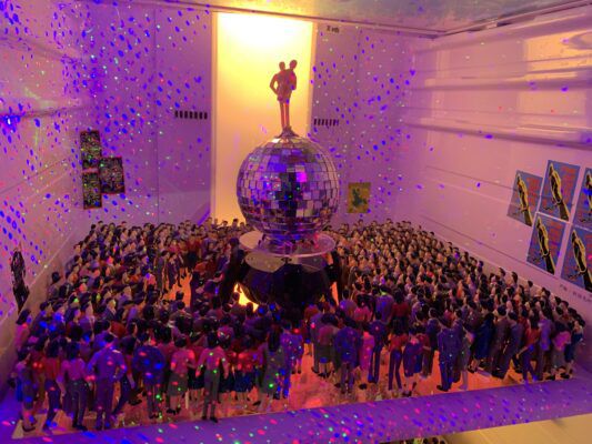 People gathering at the underground "sweatbox venue" to watch "Warm and Cool Rock".
