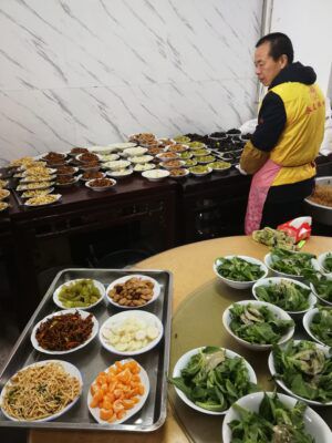 Meat alternatives such as soy-based fish and pork being offered at a Suzhou Chinese New Year dinner.