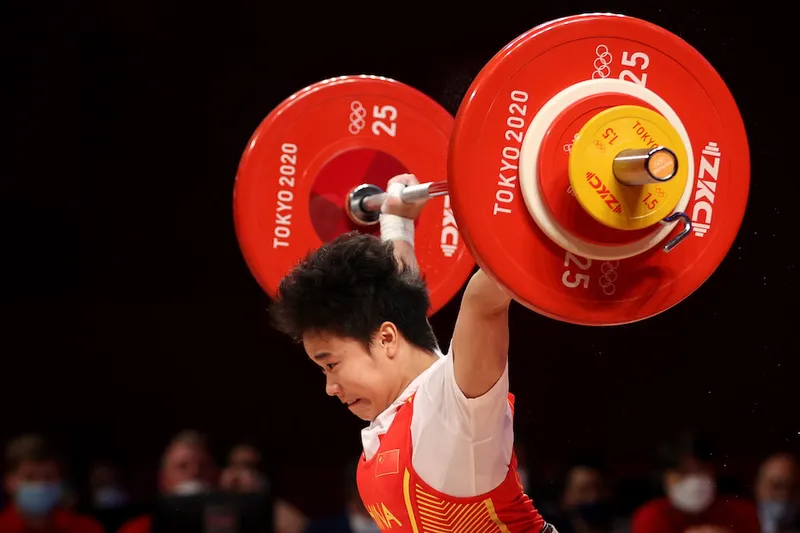 Chinese weightlifter Hou Zhihui competing in a recent event, has become part of the new group of trendy Chinese Olympic words