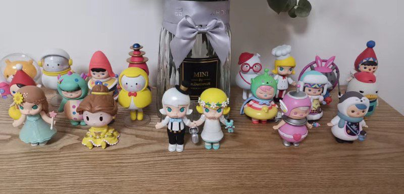 Part of Hannah's designer toy collection displayed across a tabletop.