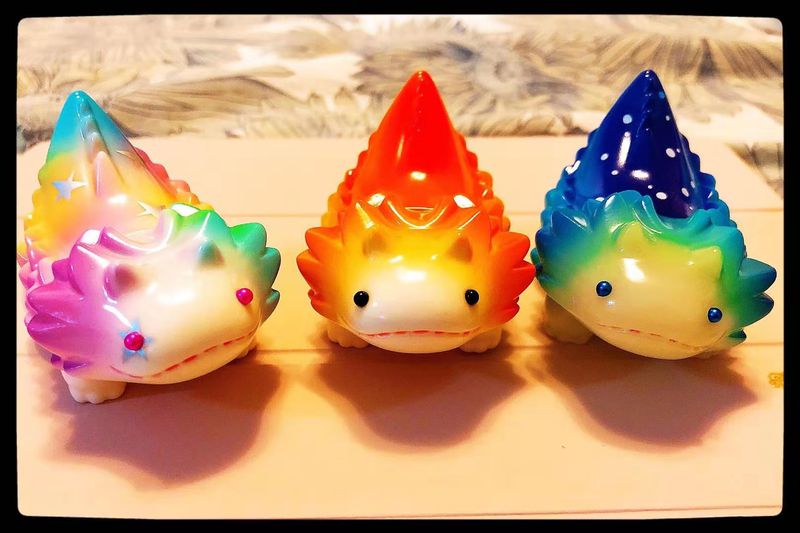 Designer toys such as these three colorful figurines have become a new addition for young Chinese workers.