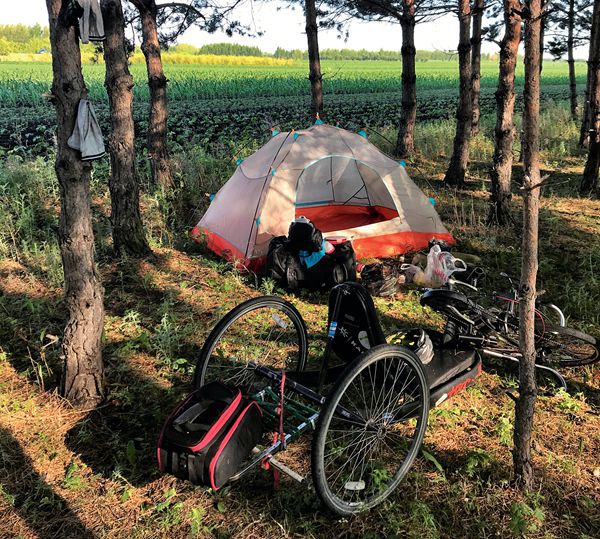 Riders take a break and set up a tent in the Chinese countryside.