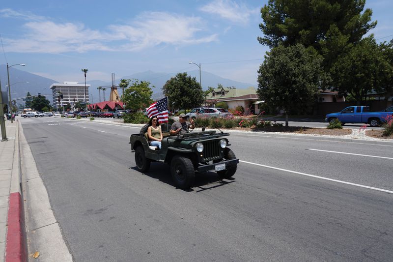 A local veteran flies the flag on an army-issue jeep on Memorial Day