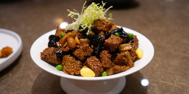 A baked bran dish on a dinner table.