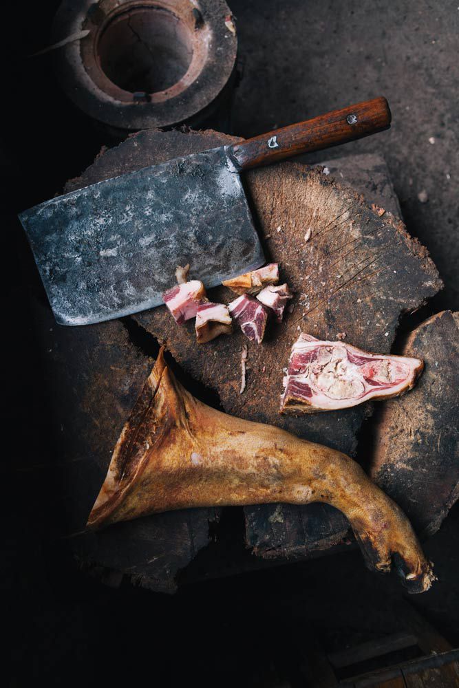 After two or three years of curing, Yunnan ham is scorched over an open fire, washed in spring water, chopped, and ready to consume 
