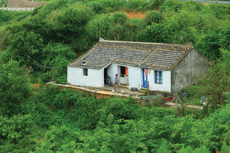 On the far side of the island, away from tourist development, Lighthouse village preserves Huaniao's original architecture and fishing economy