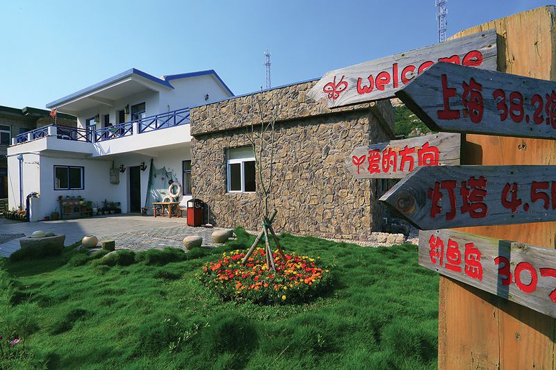 Whimsical signposts are part of the island's youthful makeover