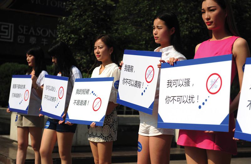 A campaign against harassment in Anhui sees women holding signs, “I have breast implants, but you have no right to touch me!” “I can be flirtatious, but you are not allowed to harass me!”