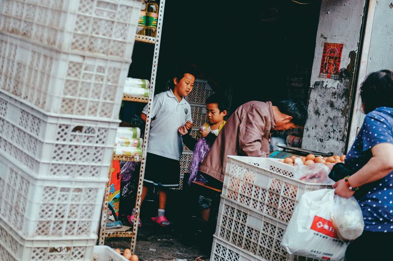 Street-side vendors, increasingly rare in Beijing's center, line the alleys, offering low-cost necessities for residents