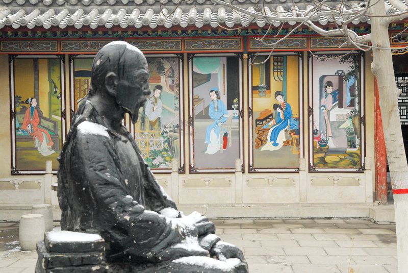 Cao Xueqin's statue in the court yard of Cao's Memorial Hall in Rongguo Mansion