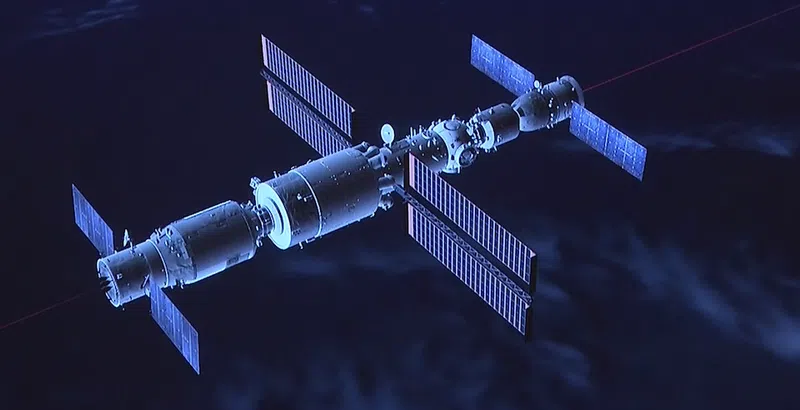 A computer-generated image of the Chinese Space Station from CCTV’s live-stream program. The Shenzhou-12 is docked at the front (right side), and the Tianzhou-2 cargo space ship is docked at the back