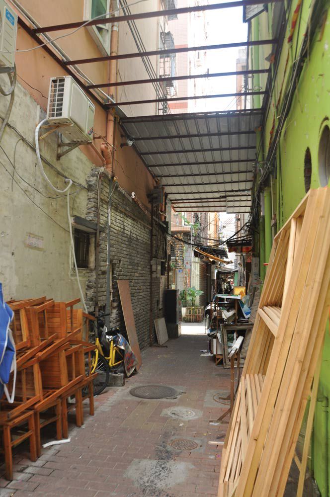 Dafen's back alleys are clustered with artists' supplies, which authorities say are a fire hazard